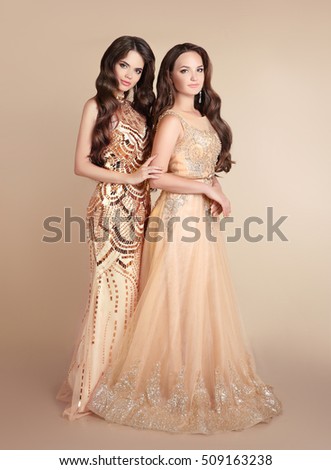 Stok fotoğraf: Glamour Brunette Girl In Fashion Golden Dress Isolated On Black