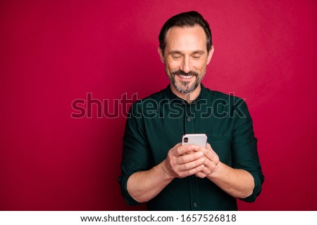 Stock photo: Happy Red Haired Handsome Man Using Phone And Smiling