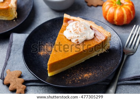 Stockfoto: Pumpkin Pie Tart Made For Thanksgiving Day With Whipped Cream On A Black Plate Top View
