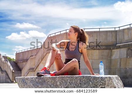 Сток-фото: Athlete Woman Standing After Sport Exercising On The Rocks By Th