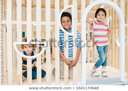Stock foto: Three Cute Kids Of Asian Caucasian And African Ethnicities Playing Together