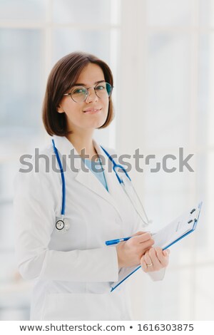 Stock foto: Qualified Cardiac Expert With Stethoscope Prepares For Health Seminar Gives Consultancy About First