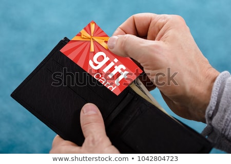 Stok fotoğraf: Human Hand Removing Gift Card From Wallet