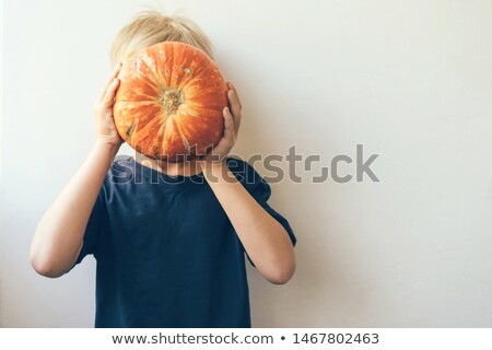 Stockfoto: Child Holding A Pumpkin