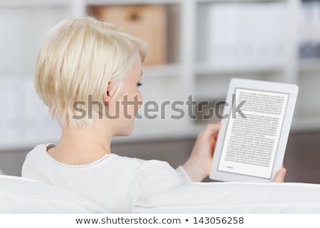 Foto stock: Closeup Of A Woman Reading Ebook