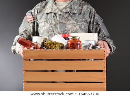 商業照片: Soldier Holding Food Drive Box