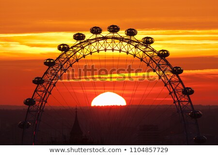 Сток-фото: London Eye On Thames River At Sunset