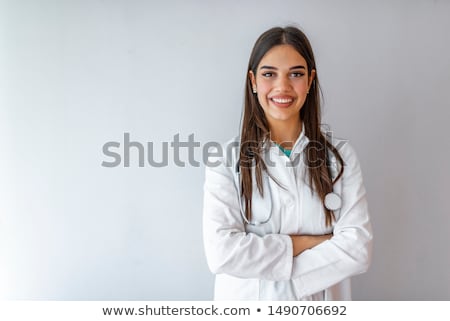 商業照片: Smiling Female Doctor Standing Arms Crossed