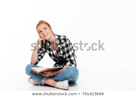 Сток-фото: Pensive Ginger Woman In Shirt Sitting On Floor With Book