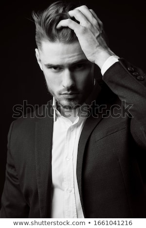 Stok fotoğraf: Portrait Of A Tired Young Bearded Man Standing