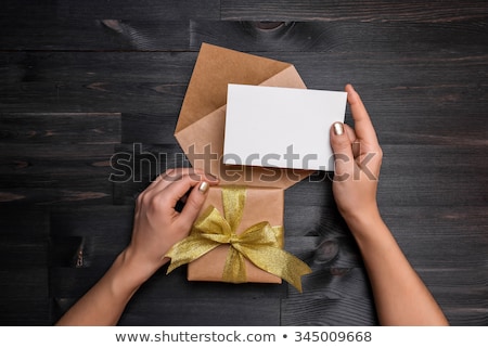 ストックフォト: Two Hands Holding Gift Card
