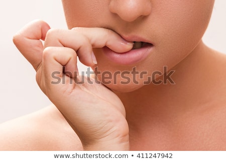 Foto d'archivio: Woman Biting Nails