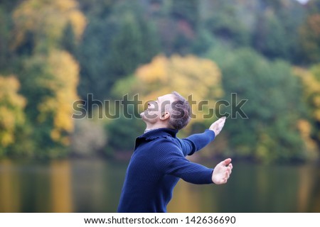 Zdjęcia stock: Man Is Standing Outside In Spring With Arms Wide Open And Breathing