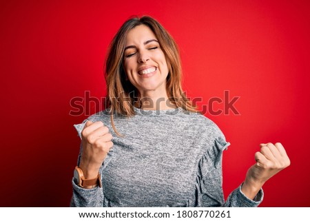 Zdjęcia stock: Happy Excited Young Woman Standing And Shouting In Winter Forest