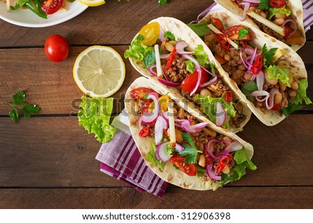 Foto stock: Mexican Tacos With Meat Beans And Salsa