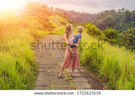 Stok fotoğraf: Mom And Son Tourists In Campuhan Ridge Walk Scenic Green Valley In Ubud Bali Traveling With Child