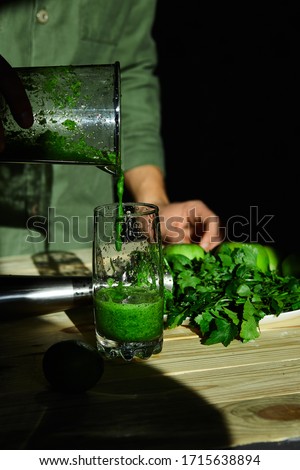 Stok fotoğraf: Man Pouring In Glass Healthy Detox Smoothie Cooking With Blender