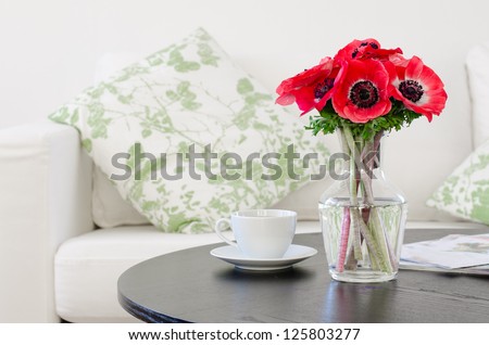 Stock fotó: Red Anemone Flowers Bouquet In A Glass Vase Bright Green Background Copy Space