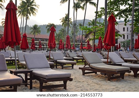 Stok fotoğraf: Tourist Couple Relaxed Inside A Beach Parasol