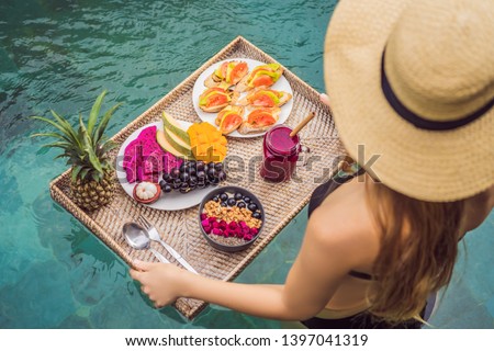 Stock fotó: Young Woman Relaxing And Eating Fruit Plate By The Hotel Pool Exotic Summer Diet Photo Of Legs Wit