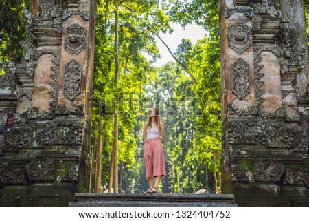 Foto stock: Young Woman Traveler Discovering Ubud Forest In Monkey Forest Bali Indonesia Traveling With Childr