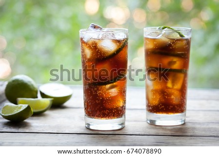 Zdjęcia stock: Glass Of Cold Cola With Citrus And Ice On Wooden Table Against D