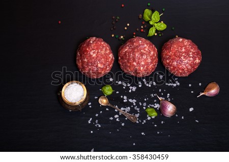 Foto stock: Beef Meatballs On Wooden Board With Pepper Salt And Garlic With Onion Parsley And Dill On Wooden B