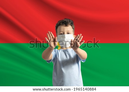 Stock fotó: Burkina Faso Flag In His Hand