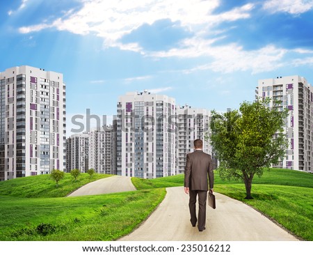 Businessman Walking Along Road Through Green Hills City Of Tall Buildings As Backdrop Charts And O Stockfoto © cherezoff