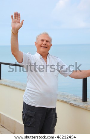 Stock photo: Smiling Senior On Veranda Near Seacoast