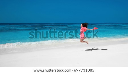 Foto stock: Summer Vacation Beautiful Free Woman Jumping On The Exotic Sea