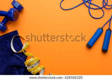 Zdjęcia stock: Various Sports Equipment Measuring Tape And Towel Isolated On Orange