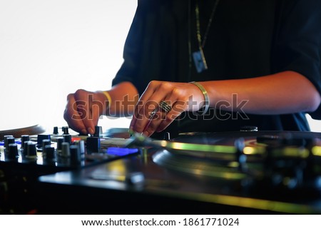 Stock fotó: Female Dj Adjusting Sound Levels