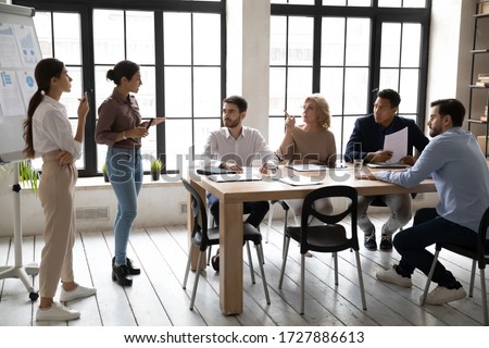 Foto stock: Young Confident Businesswoman Looking At Client Or Partner During Interaction