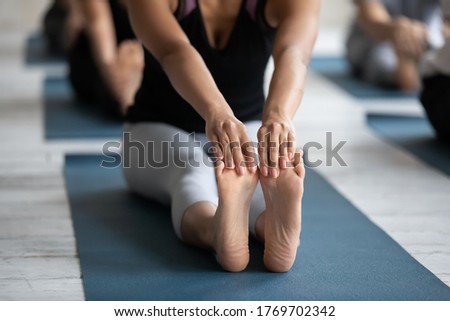 Сток-фото: Front View Of Young Female Yoga Teacher Teaching Yoga To School Kids In School