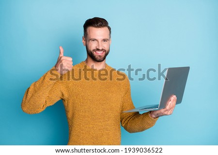 Stock fotó: Young Cheerful Businessman In Blue Pullover Showing Thumbs Up In Isolation