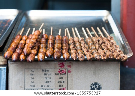Stock photo: Grill And Fried Silkworm Pupae On Stick From Wangfujing Street At Beijing China