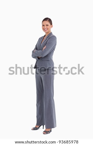 Сток-фото: Side View Of Smiling Tradeswoman With Her Arms Folded Against A White Background