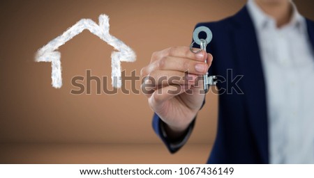 Stockfoto: Holding Key With House Drawings In Front Of Vignette With Handshake