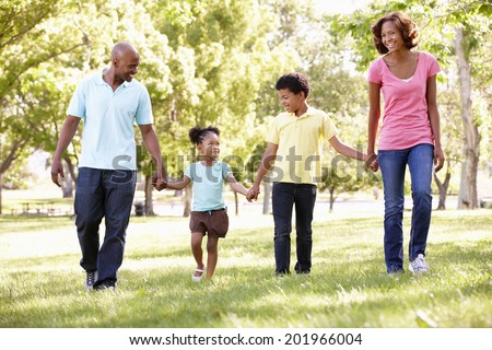 Stock photo: Father Holds Daughter 2 Years On Hand In The Sunshine Trees In The Background Of Brightly Colored L