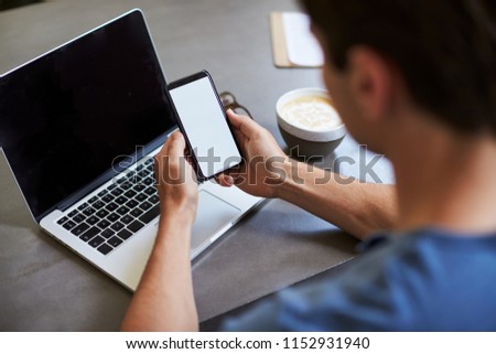 Stock photo: Back View Of Caucasian Man Looking At Phone Focus In The Phone