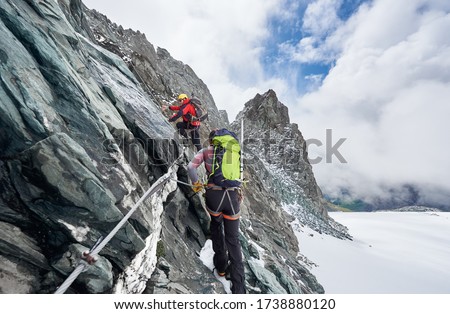 Сток-фото: Tourist Climbing Outdoor Wall