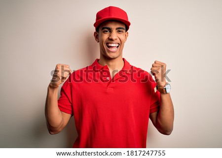 [[stock_photo]]: Portrait Of Excited African American Man Wearing Hat And Scarf G