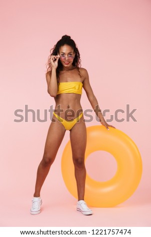 Stock foto: Woman In Swimwear Holding Rubber Ring Posing Isolated Over Pink Background