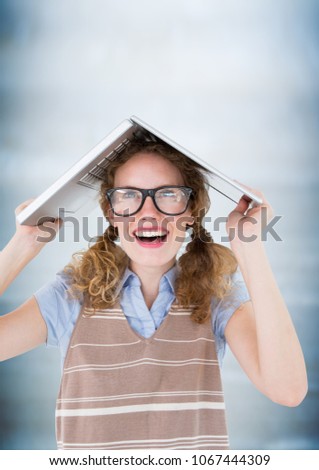 Stockfoto: Nerd Woman With Laptop On Head Against Blurry Blue Wood Panel