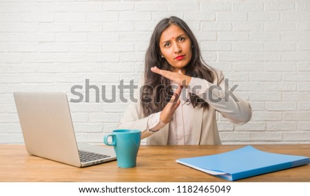 Stok fotoğraf: Portrait Of A Serious Businesswoman Making A Stop Sign Against A White Background