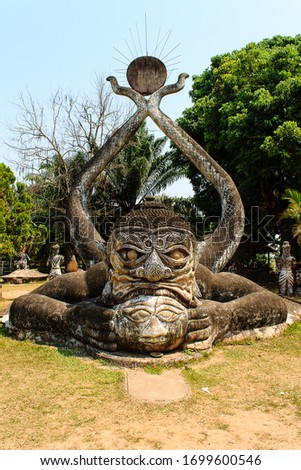 Foto d'archivio: Mythology And Religious Statues At Wat Xieng Khuan Buddha Park