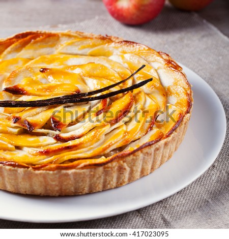 Stock fotó: Apple Tart With Vanilla Pod On A White Plate Traditional Holiday Dessert