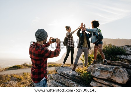 Stok fotoğraf: Woman Tourist Taking Pictures On The Phone Nature