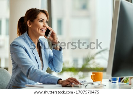 Zdjęcia stock: Young Woman Graphic Designer Using Pc Computer Talking By Mobile Phone Working At Night In Office